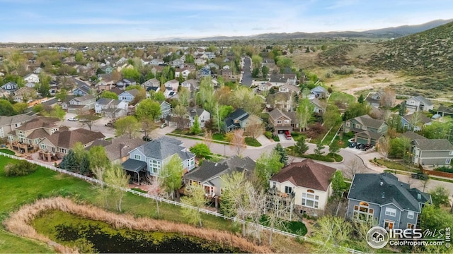 bird's eye view featuring a mountain view and a residential view
