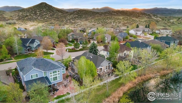 bird's eye view featuring a mountain view and a residential view