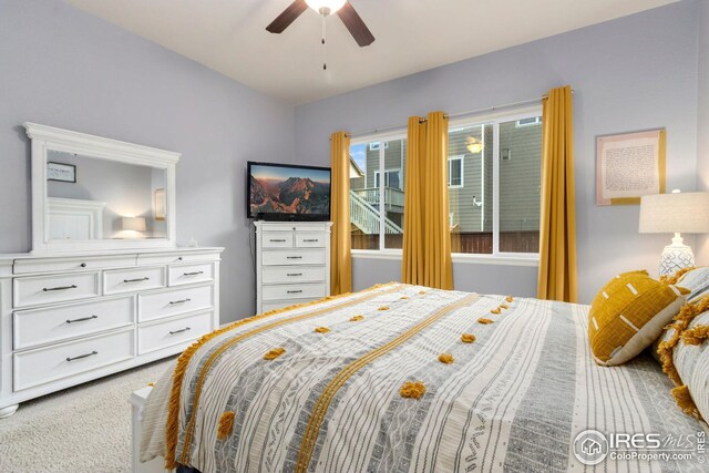 carpeted bedroom featuring ceiling fan