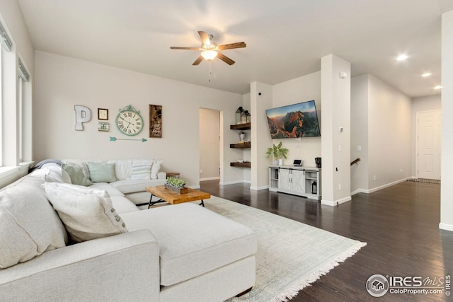 living area featuring recessed lighting, baseboards, ceiling fan, and dark wood finished floors
