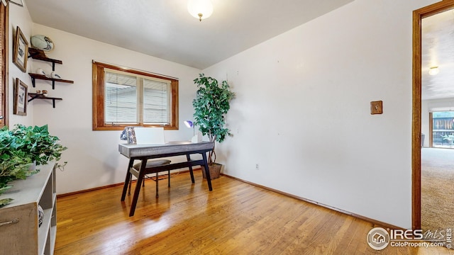 dining room with light wood-style floors and baseboards