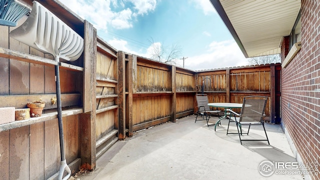 view of patio / terrace featuring fence and outdoor dining space
