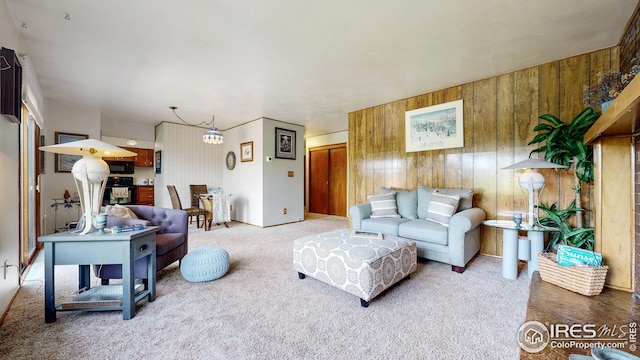 living room with wooden walls and carpet