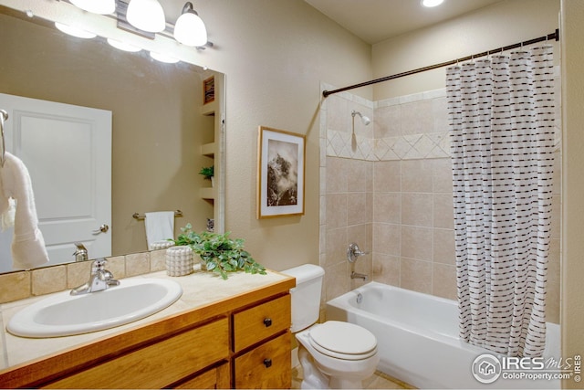bathroom with vanity, shower / bathtub combination with curtain, and toilet