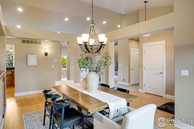 dining space with an inviting chandelier, recessed lighting, light wood-type flooring, and visible vents