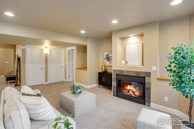 living room with light colored carpet, recessed lighting, baseboards, and a fireplace