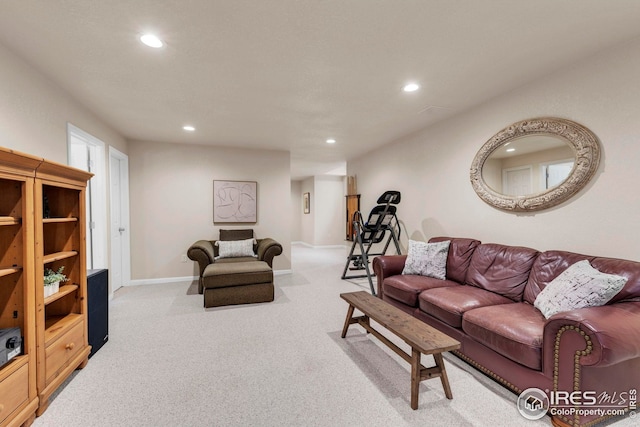 living area featuring carpet floors, baseboards, and recessed lighting