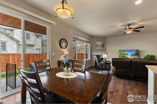dining room featuring recessed lighting, a ceiling fan, and dark wood finished floors