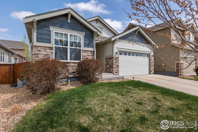 craftsman inspired home with a front lawn, fence, stone siding, concrete driveway, and an attached garage