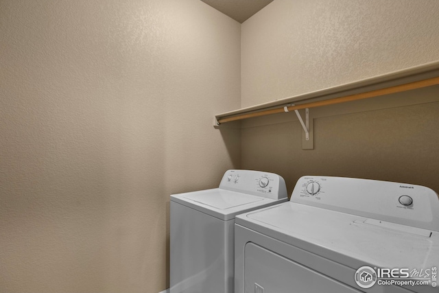 laundry room with laundry area and washer and clothes dryer