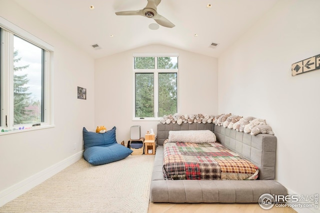 bedroom with baseboards, ceiling fan, lofted ceiling, and visible vents