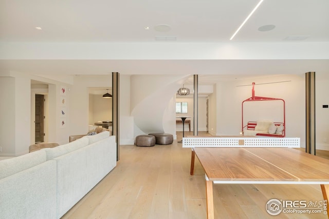interior space featuring visible vents and light wood-style floors