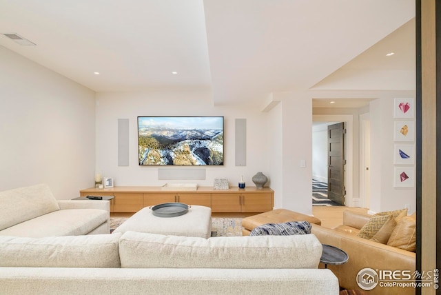 living room with recessed lighting and visible vents