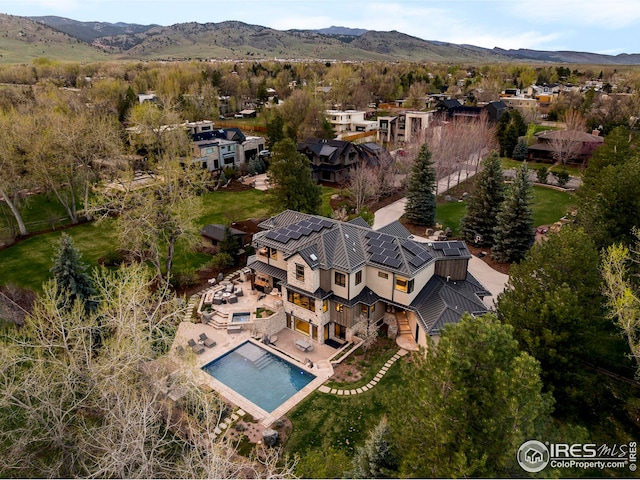 drone / aerial view featuring a mountain view and a residential view