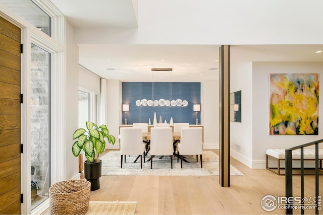 dining space featuring recessed lighting, baseboards, and light wood-type flooring