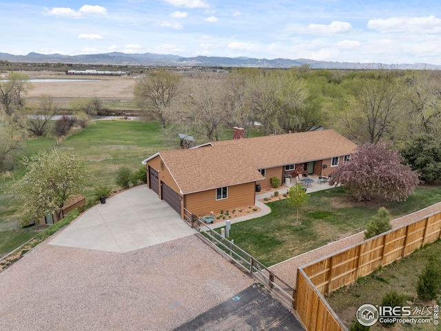 drone / aerial view featuring a mountain view
