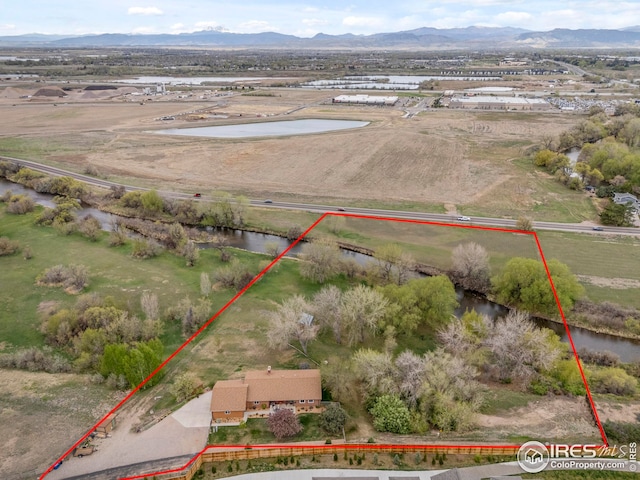 bird's eye view featuring a rural view and a water and mountain view