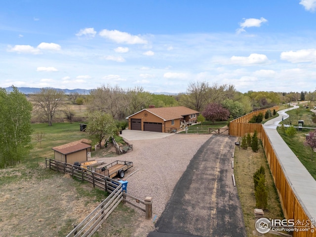 aerial view featuring a rural view and a mountain view