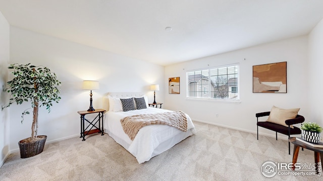 bedroom featuring baseboards and carpet flooring