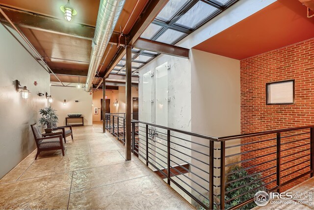 210 W Magnolia St Unit 320, Fort Collins, CO 80521 - corridor with an upstairs landing and stone finish floor