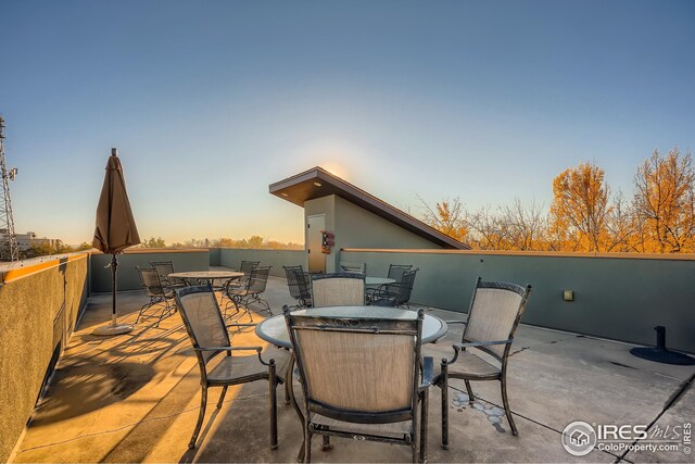 210 W Magnolia St Unit 320, Fort Collins, CO 80521 - patio terrace at dusk with outdoor dining space