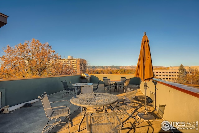210 W Magnolia St Unit 320, Fort Collins, CO 80521 - view of patio / terrace with a mountain view and outdoor dining area