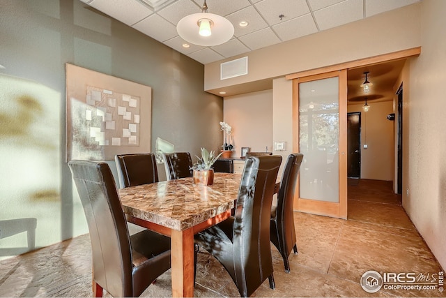210 W Magnolia St Unit 320, Fort Collins, CO 80521 - dining room with a drop ceiling and visible vents