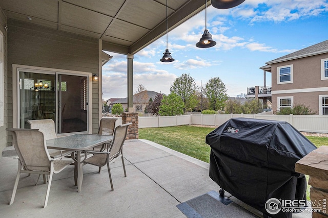 view of patio / terrace with grilling area, outdoor dining area, and a fenced backyard