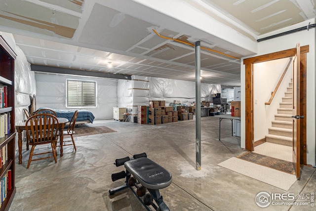 basement featuring stairs