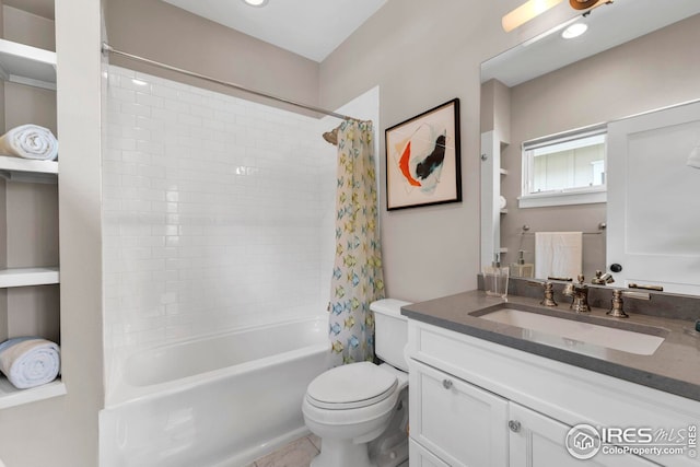 full bathroom with vanity, shower / bathtub combination with curtain, and toilet