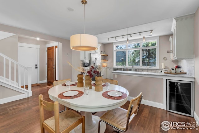 dining space with baseboards, dark wood-type flooring, stairway, and wine cooler