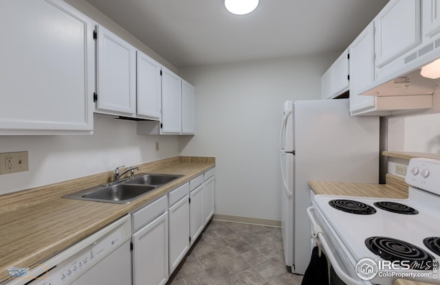 kitchen featuring a sink, light countertops, custom range hood, white appliances, and white cabinetry