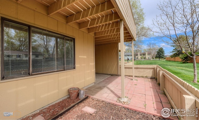 view of patio / terrace featuring fence