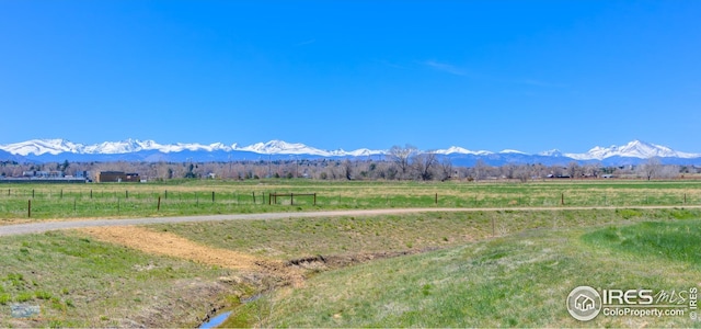 mountain view featuring a rural view