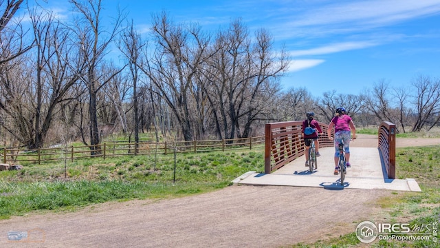 view of property's community with fence