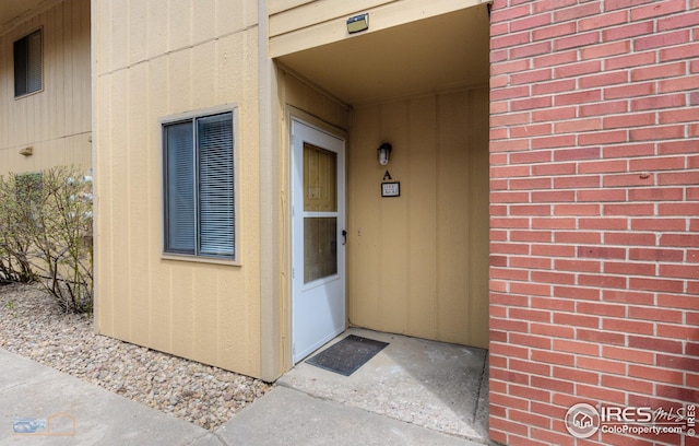 doorway to property with board and batten siding
