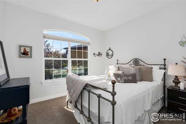 carpeted bedroom with baseboards