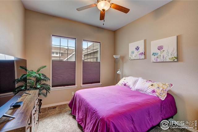bedroom featuring carpet floors, baseboards, and ceiling fan
