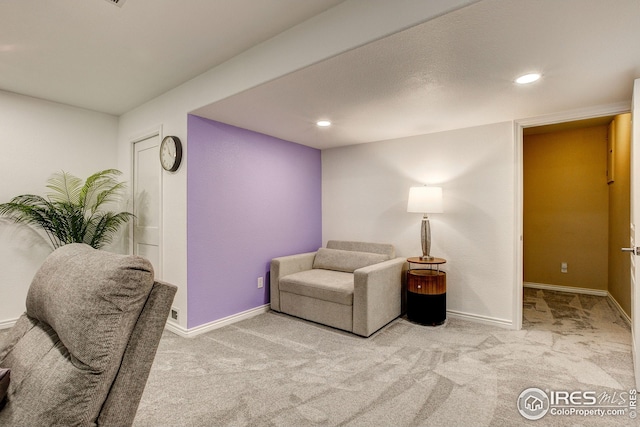sitting room featuring carpet floors, recessed lighting, and baseboards