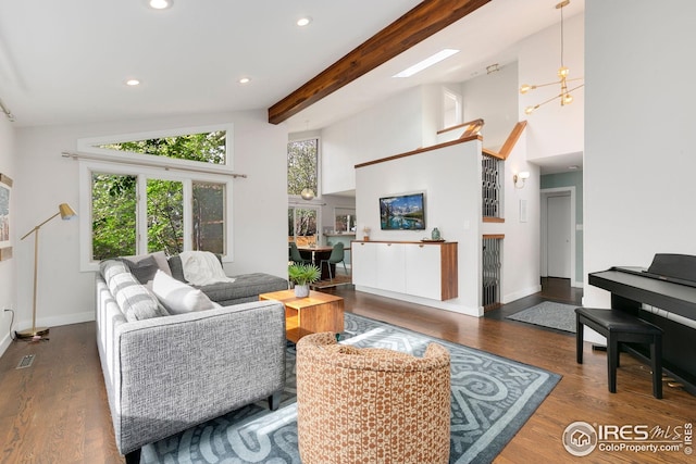 living area featuring baseboards, a high ceiling, recessed lighting, and wood finished floors