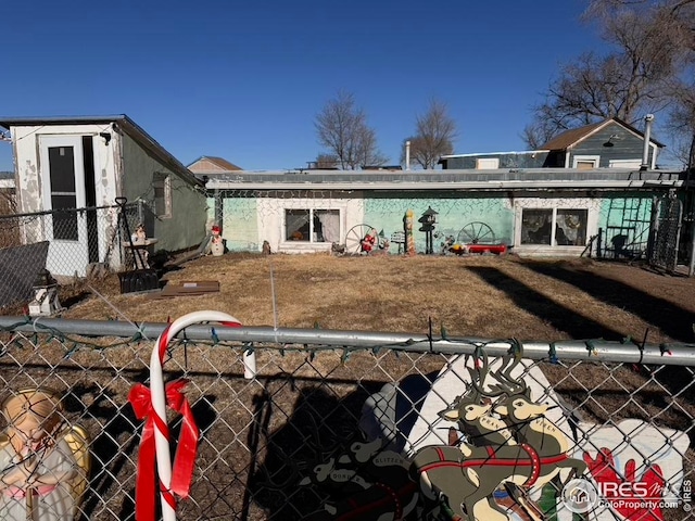 back of property featuring fence