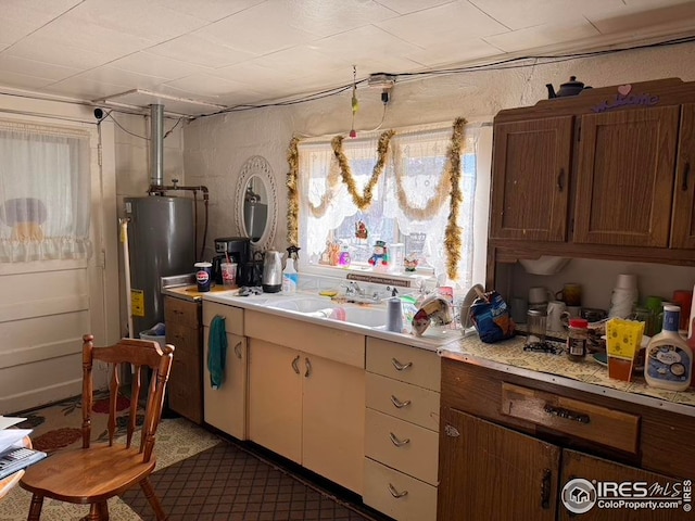 kitchen featuring light countertops and water heater