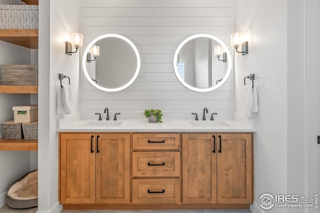 bathroom with double vanity and a sink