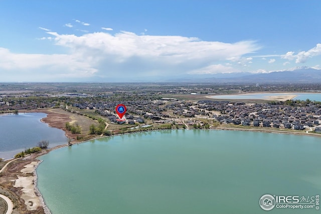 aerial view featuring a water and mountain view