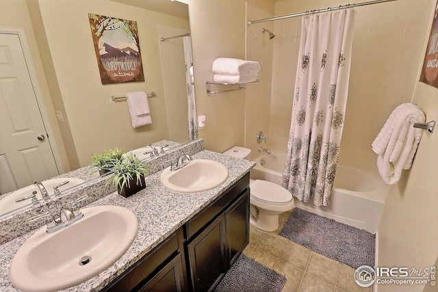 full bath with toilet, a sink, tile patterned flooring, and shower / tub combo