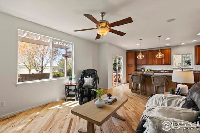 6117 Gold Dust Rd, Timnath, CO 80547 - living room with ceiling fan, recessed lighting, light wood finished floors, and baseboards