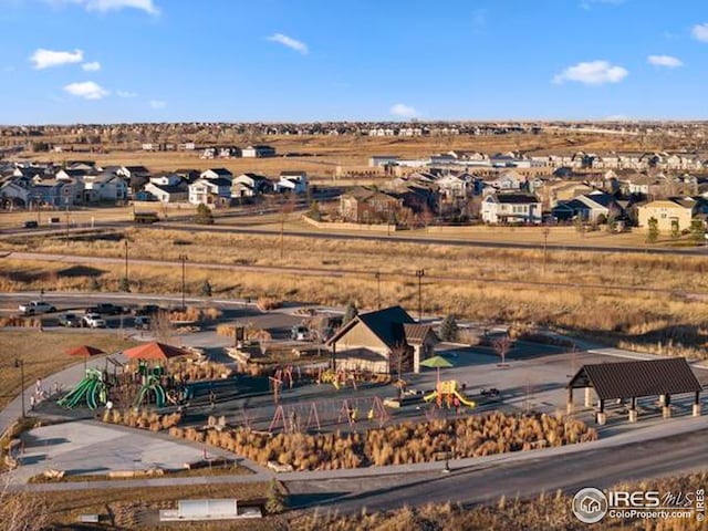 birds eye view of property with a residential view