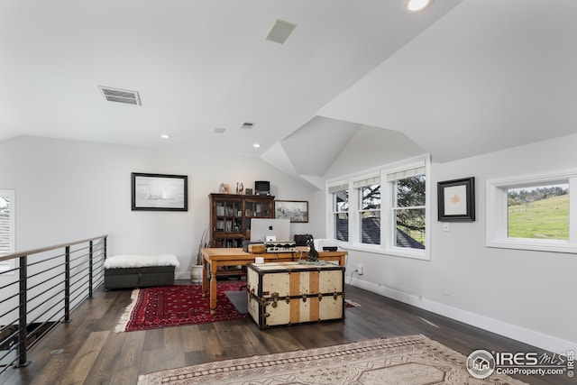 office area featuring baseboards, vaulted ceiling, dark wood finished floors, and visible vents