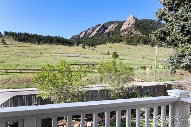 doorway to outside featuring plenty of natural light, a rural view, and a mountain view