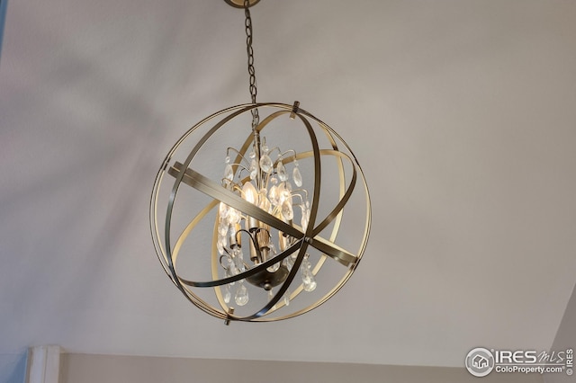 interior details featuring a notable chandelier